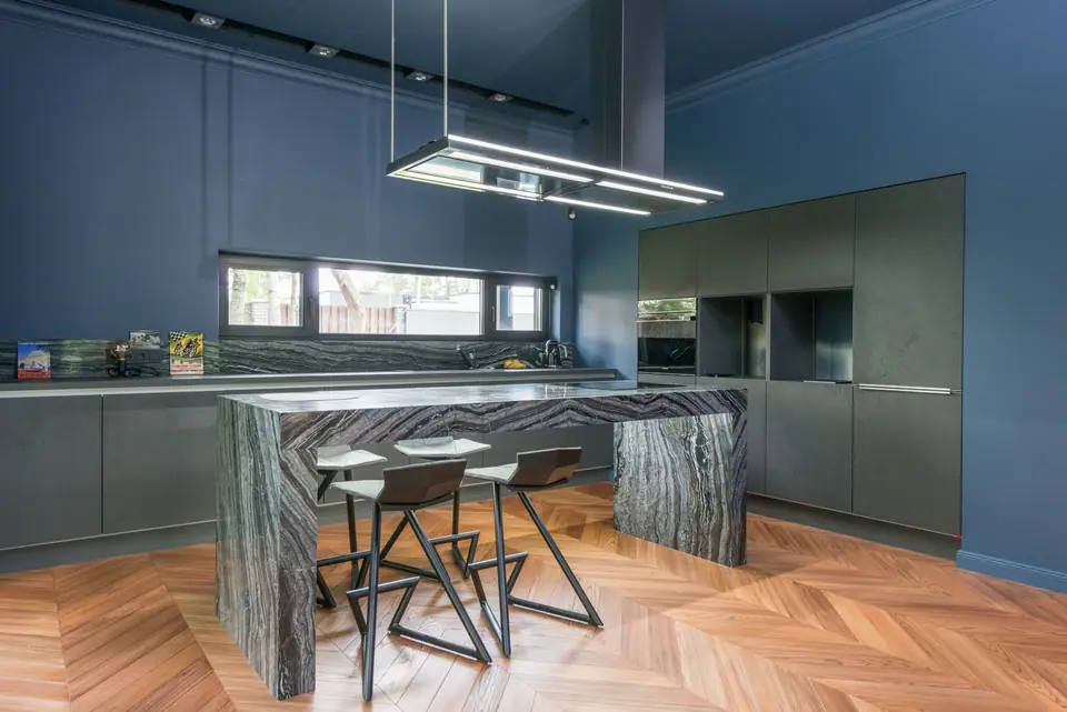 Open-plan kitchen with linear pendant light