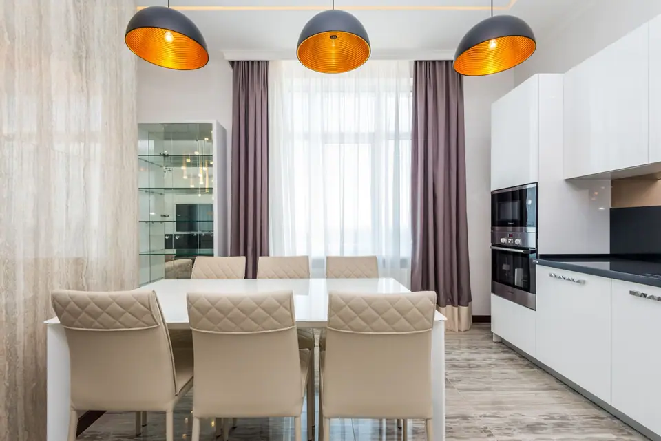 Pendant lights fitted over a dining table