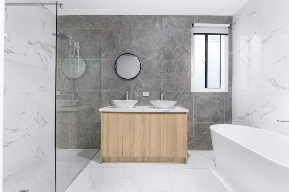Bathroom with freestanding bath and double basin